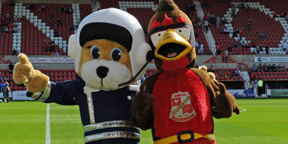 WAA mascot Marsha with Swindon Town FC mascot Rockin' Robin. WAA mascot Marsha with Swindon Town FC mascot Rockin' Robin.
