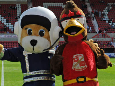 WAA mascot Marsha with Swindon Town FC mascot Rockin' Robin. WAA mascot Marsha with Swindon Town FC mascot Rockin' Robin.