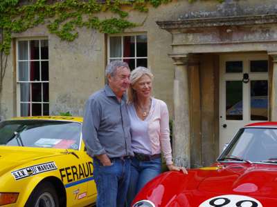 A photo of Nick and Annette Mason in front of the Middlewick House and two sports cars. A photo of Nick and Annette Mason in front of the Middlewick House and two sports cars.