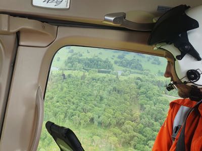 Dr Jono Holme admiring the view of green fields and tress from the Wiltshire Air Ambulance helicopter Dr Jono Holme admiring the view of green fields and tress from the Wiltshire Air Ambulance helicopter