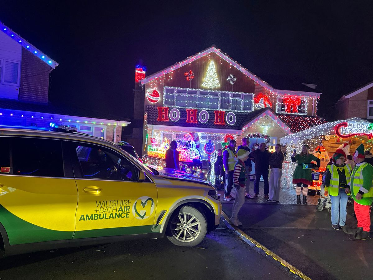 Yellow and green Wiltshire and Bath Air Ambulance critical care car at Sarum Avenue Christmas lights in Melksham Yellow and green Wiltshire and Bath Air Ambulance critical care car at Sarum Avenue Christmas lights in Melksham
