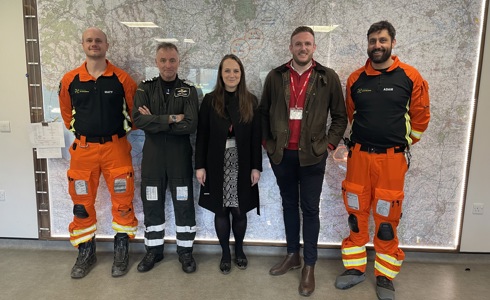 Representatives from Backhouse with a pilot and two paramedics