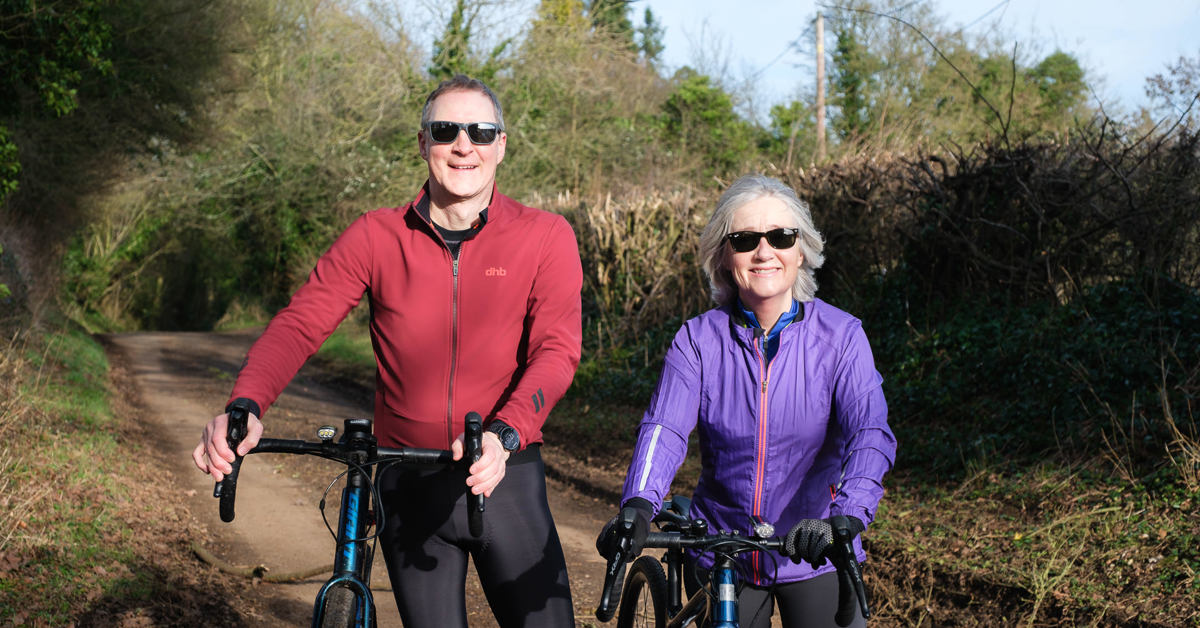 A photo of Nick and Gaynor Cole posing with bicycles