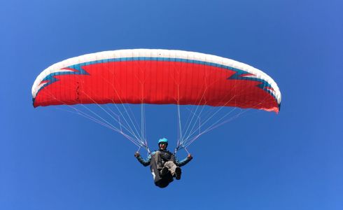 Chris Williams, who was airlifted by Wiltshire Air Ambulance, paragliding in the skies