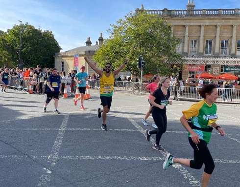 Paramedic Adam Khan running the Bath Half Marathon in 2023