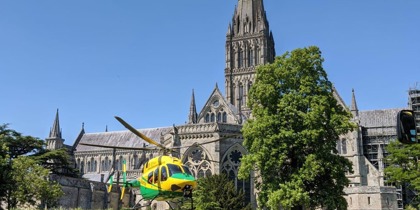 Wiltshire Air Ambulance taking off from Salisbury Cathedral Wiltshire Air Ambulance taking off from Salisbury Cathedral
