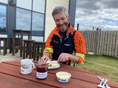 Dr Reuben Cooper enjoying tea and scones in the Wiltshire Air Ambulance garden. Dr Reuben Cooper enjoying tea and scones in the Wiltshire Air Ambulance garden.