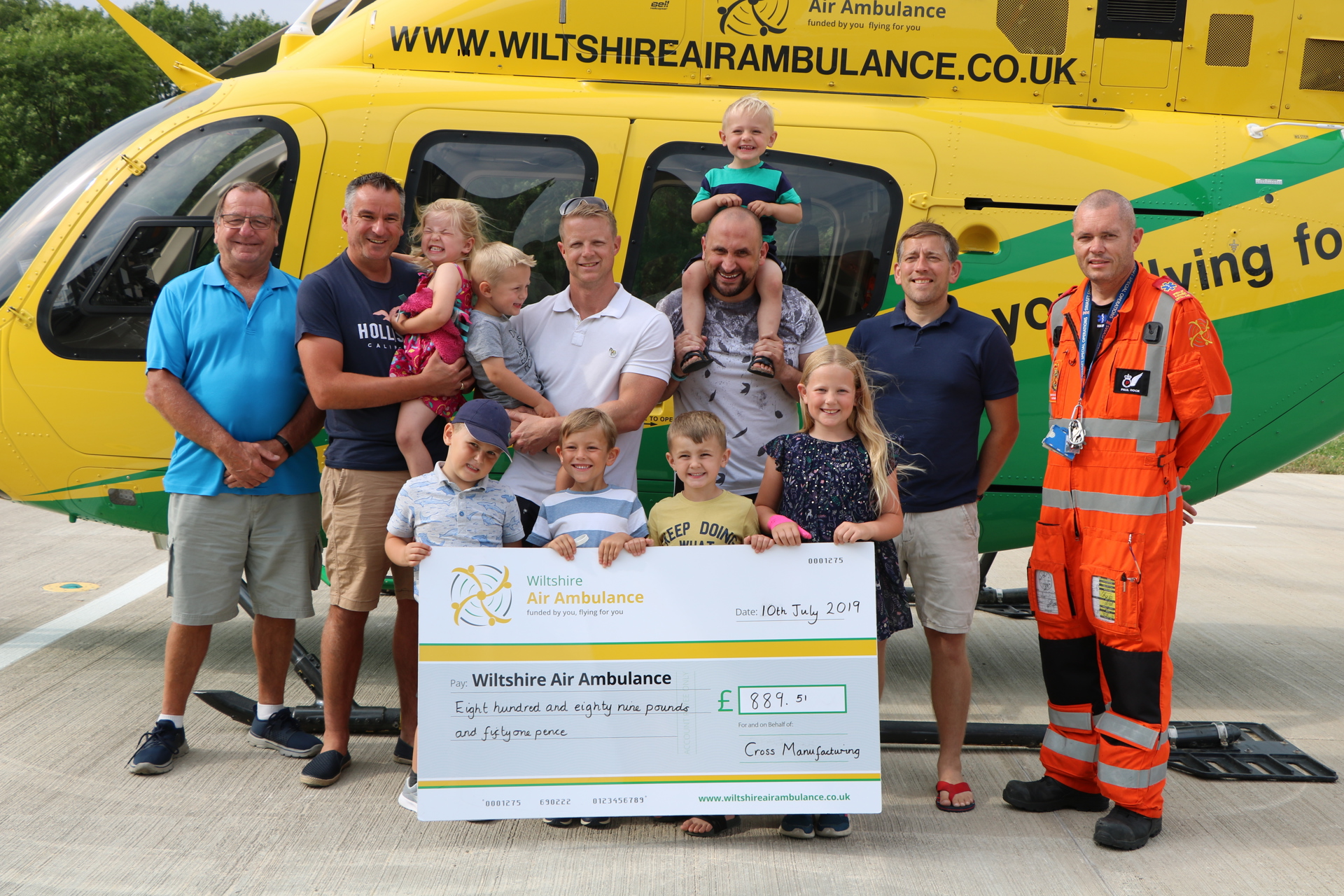 A group of adults and children from Cross Manufacturing presenting a cheque to WAA in 2019 A group of adults and children from Cross Manufacturing presenting a cheque to WAA in 2019