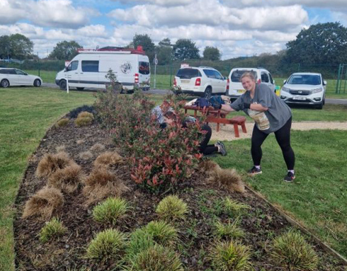 A member of Fexco staff volunteering at the airbase by gardening