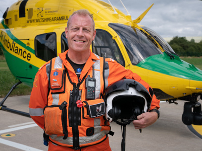 Critical care paramedic Keith Mills on the helipad with the Wiltshire Air Ambulance helicopter in the background. Critical care paramedic Keith Mills on the helipad with the Wiltshire Air Ambulance helicopter in the background.