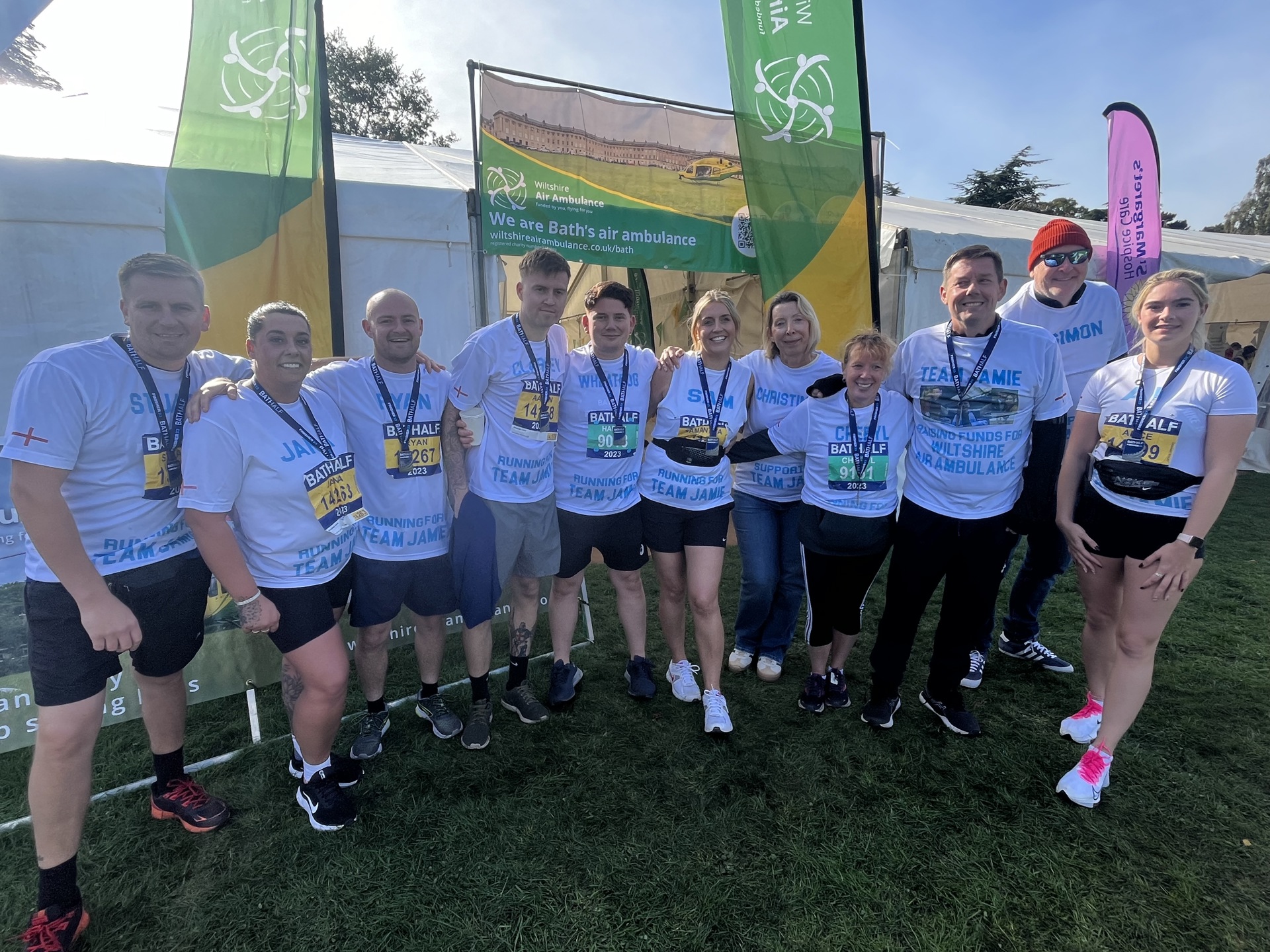 A group of runners with Bath Half Marathon medals