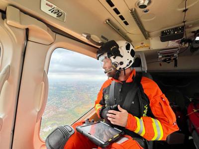 Critical care paramedic Ben Abbott admiring the view from the Wiltshire Air Ambulance helicopter. Critical care paramedic Ben Abbott admiring the view from the Wiltshire Air Ambulance helicopter.